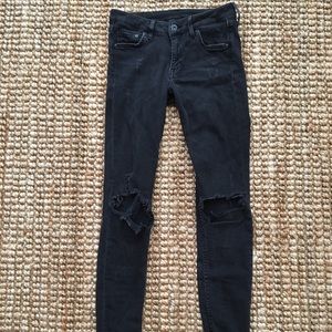 Stretchy black distressed denim